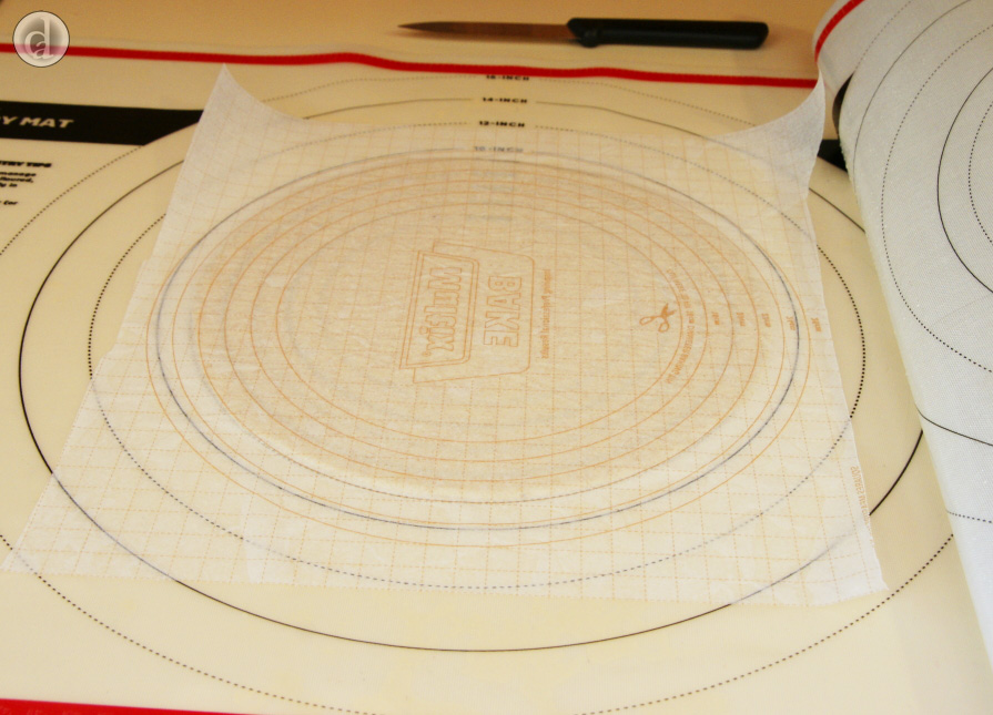 Put baking paper on top of the cutout dough