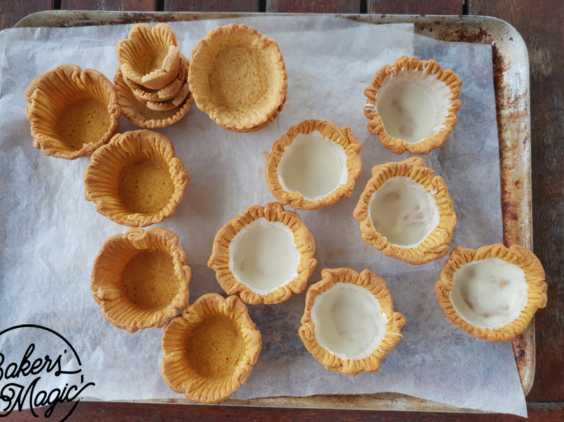 Coating the baked cases with white chocolate